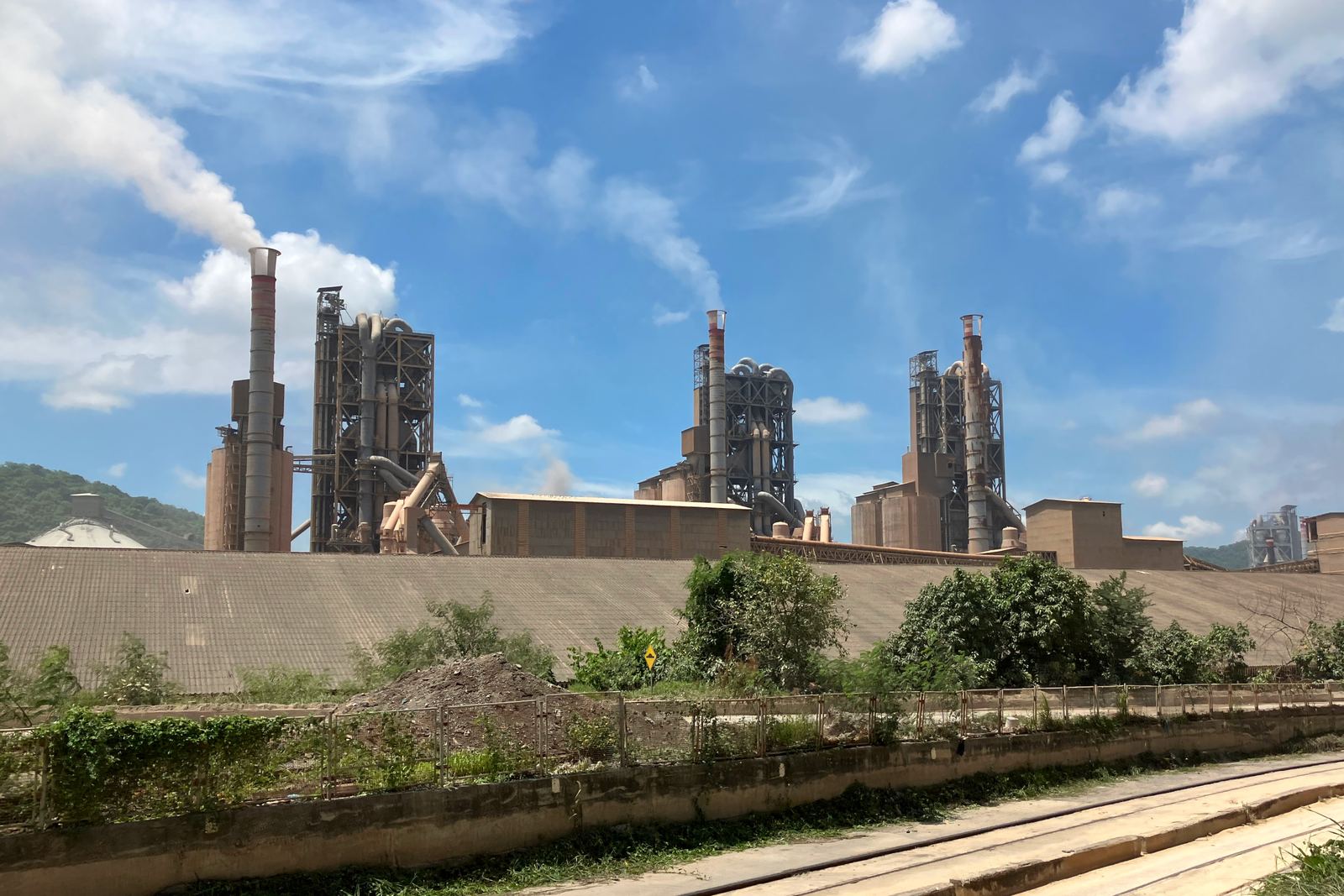 A cement plant with kiln and conveyor infrastructure